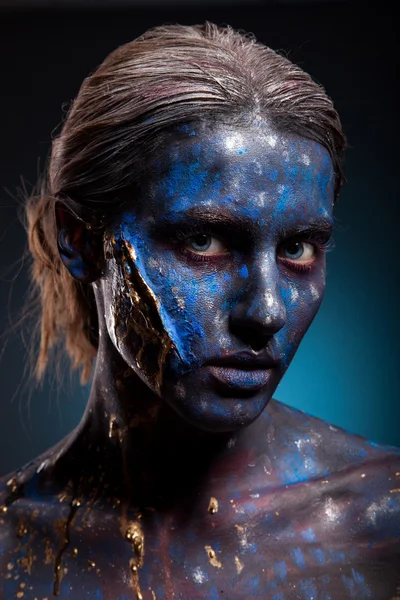 Blue face art woman with scar on face — Stock Photo, Image