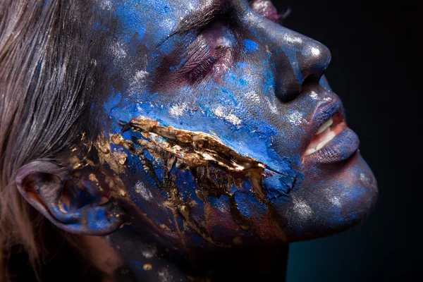 Blue face art woman with scar on face — Stock Photo, Image