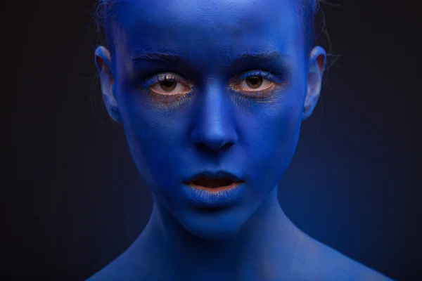 Woman with creative blue face art — Stock Photo, Image