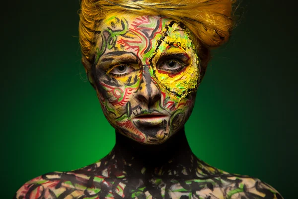 Woman with body and face art — Stock Photo, Image