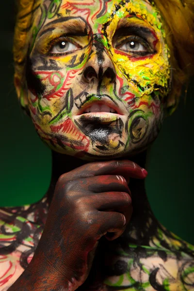 Woman with body and face art — Stock Photo, Image