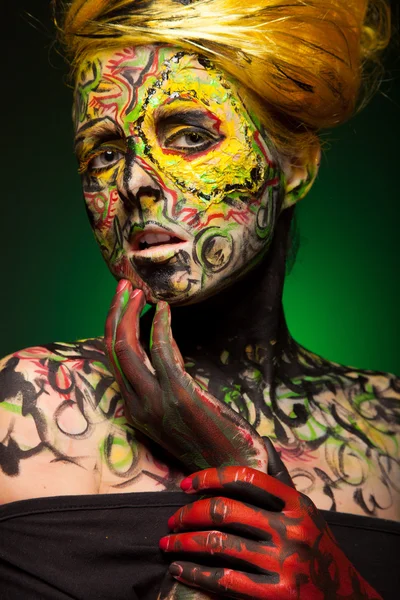 Woman with body and face art — Stock Photo, Image