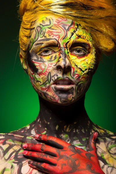 Woman with body and face art — Stock Photo, Image