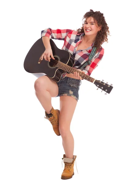 Young female musician with guitar — Stock Photo, Image