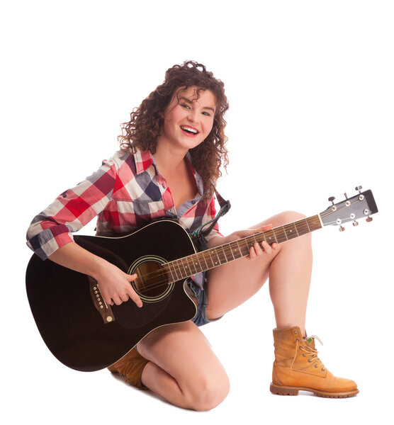 Young female musician with guitar