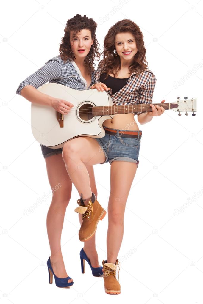 Young female musicians with guitar