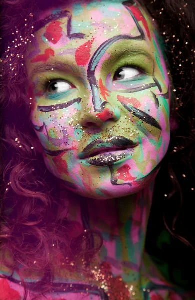 Woman with face art and curly hair — Stock Photo, Image