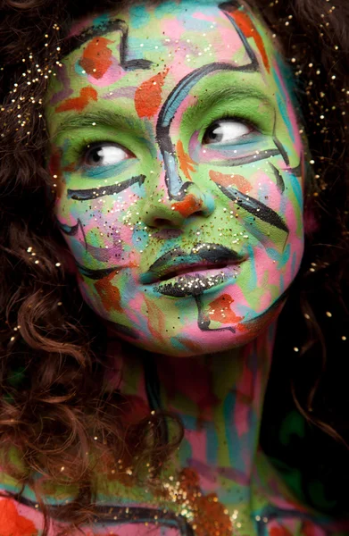 Woman with face art and curly hair — Stock Photo, Image