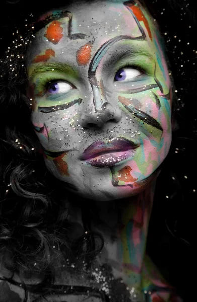 Woman with face art and curly hair — Stock Photo, Image