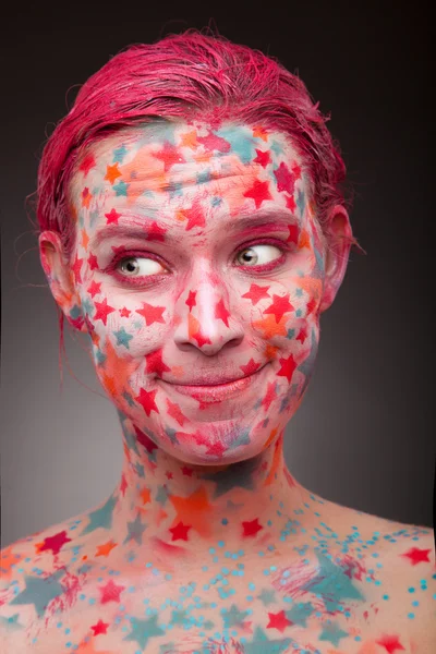 Glad woman with stars on the face — Stock Photo, Image