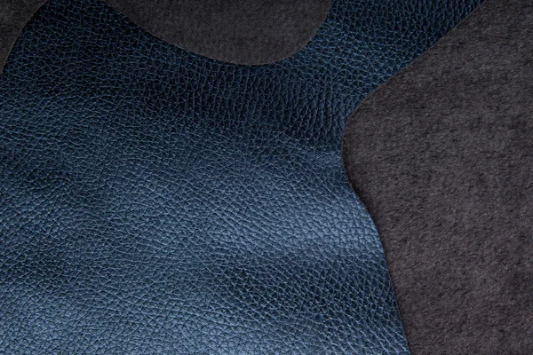 単純なテキストのためのスペースとの背景の青い革の質感 — ストック写真