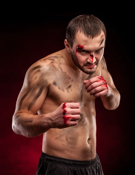 Muscular boxer in studio shooting