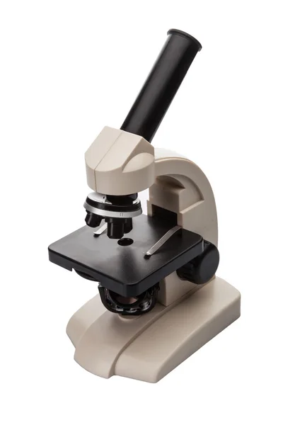 Микроскоп на белом фоне — стоковое фото