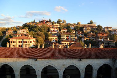 Traditional Turkish houses in Safranbolu with the caravaserai in the foreground. clipart