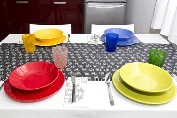 Table set with colorful dishes — Stock Photo, Image