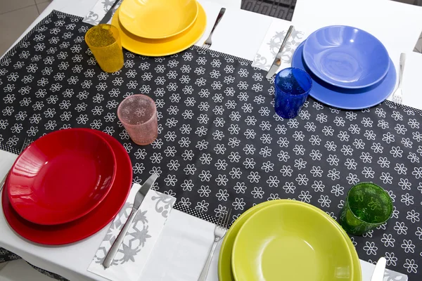 Table set with colorful dishes — Stock Photo, Image