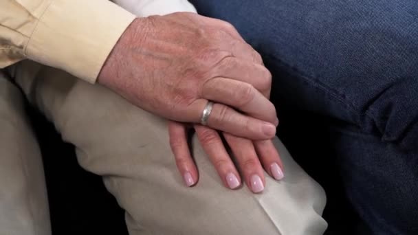 Caring elderly grandpa holding hand his wife supporting senior grandma wife. — Stock Video