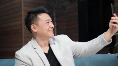  Handsome Man is having friendly Video-Call with Friends, Partners. Technology.