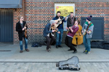 LONDON - MAR 13 : Group of Men Busking on the Southbank in Londo clipart