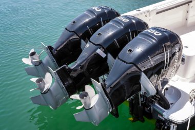 PUERTO BANUS ANDALUCIA/SPAIN - MAY 26 : Three Outboard Engines o clipart