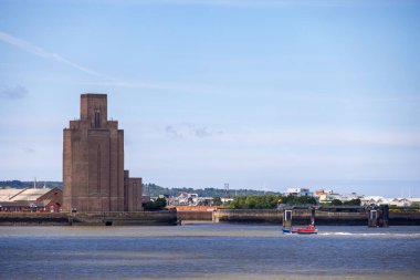 BIRKENHEAD, WIRRAL, UK - JULY 14 : The art deco brick ventilation tower of the Queensway road tunnel under the River Mersey, in Birkenhead, Wirral, UK on July 14, 2021 clipart