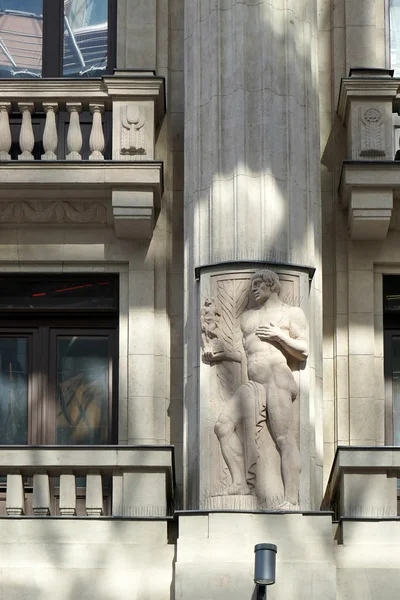 Statue of a male figure on an apartment block in Budapest Stock Picture