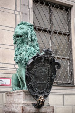 Statue of  a green Lion at Odeonsplatz in Munich clipart