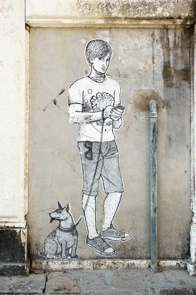 Painting of boy and dog on a wall in venice — Stock Photo, Image