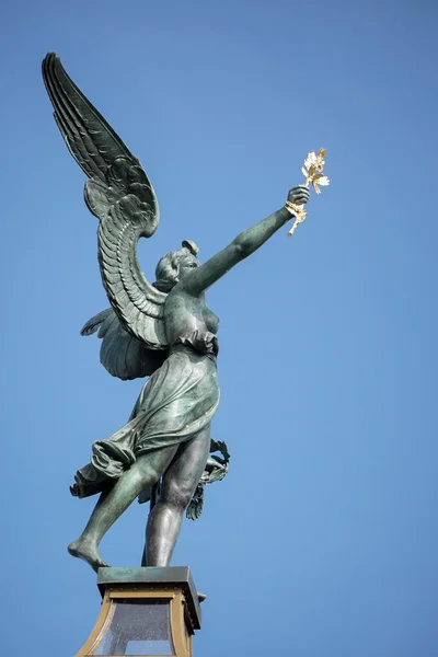 Angel on top of a column on the Cechuv Most Bridge in Prague — Stock Photo, Image
