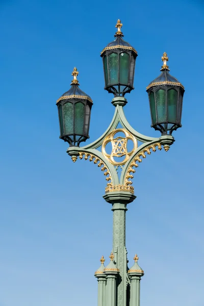 Ornate lamps on Westminster Bridge in London — Stock Photo, Image