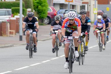 Cyclists participating in the Velethon Cycling Event in Cardiff  clipart