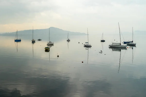 LESA, ITALY/ EUROPE - SEPTEMBER 17: Yachts in the early morning Royalty Free Stock Images