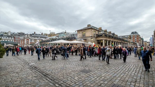 LONDON - DEC 20 : People Walking around Covent Garden in London 