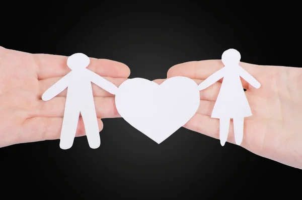 Paper family with heart in hands — Stock Photo, Image