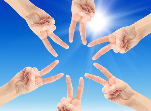 Hands forming the star shape — Stock Photo, Image