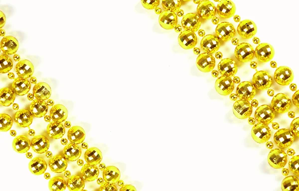 Brilliant celebratory beads of golden color — Stock Photo, Image