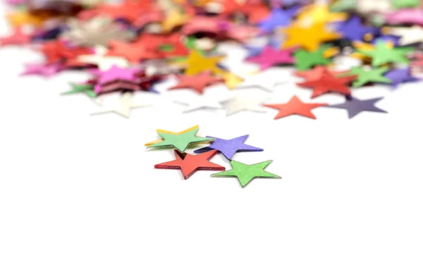 Christmas decoration of colored confetti stars — Stock Photo, Image