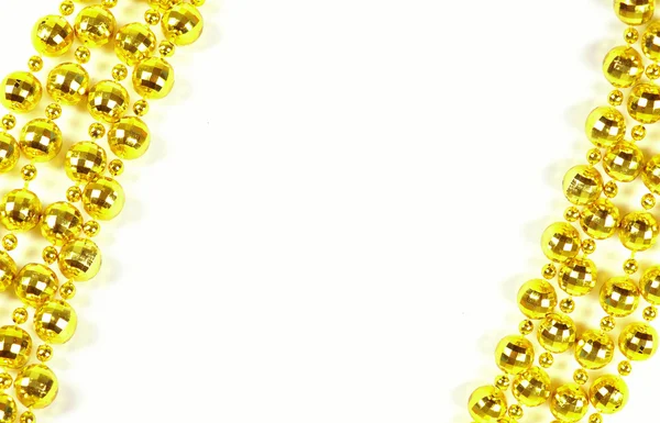 Brillante festliche Perlen von goldener Farbe — Stockfoto