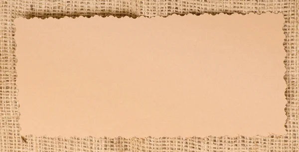 Starý papír značka na přírodní pytlovina — Stock fotografie