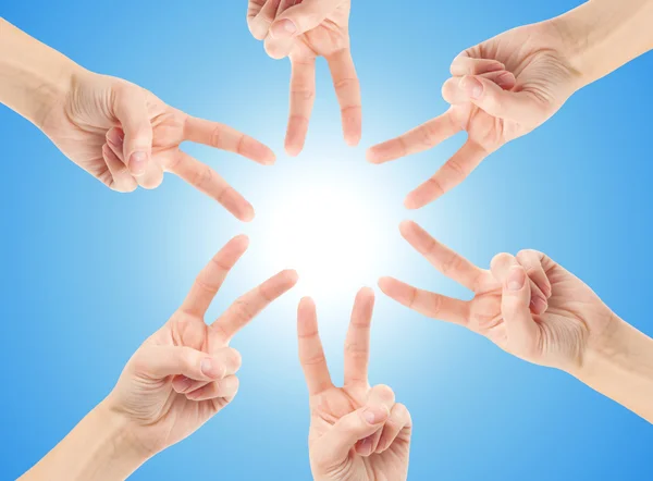 Hands forming the star shape — Stock Photo, Image