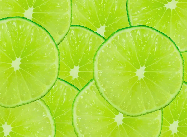 Achtergrond van groene citrus segmenten — Stockfoto