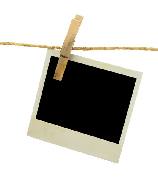 Blank instant photo hanging on the clothesline — Stock Photo, Image