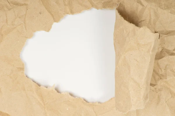 Ripped white paper against a white — Stock Photo, Image