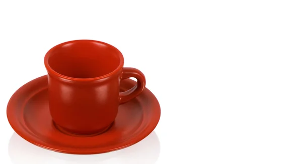 Červený pohár na červený talířek — Stock fotografie