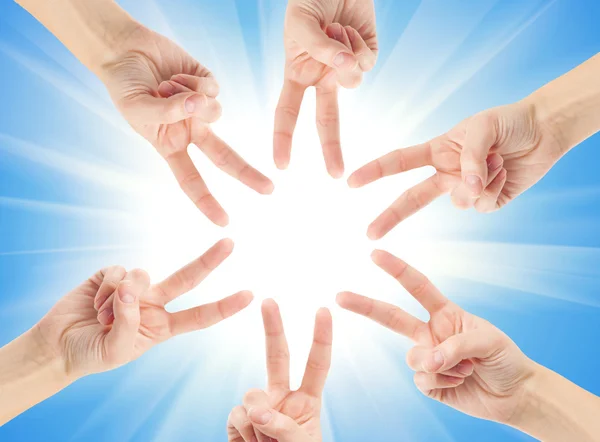 Hands forming the star shape — Stock Photo, Image