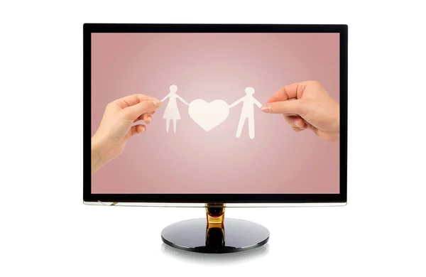 Monitor with a paper family in hands — Stock Photo, Image