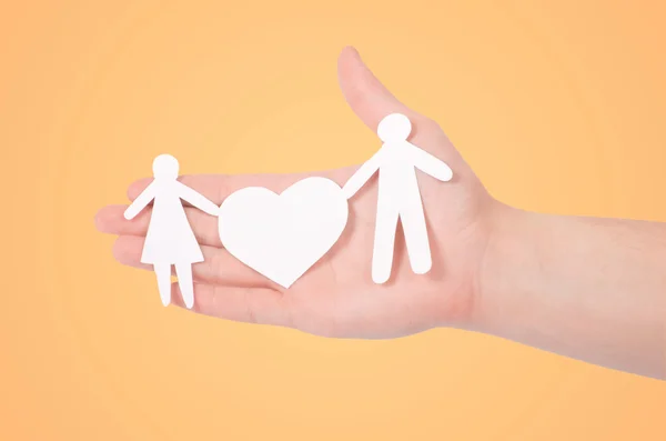 Paper family with heart in hand — Stock Photo, Image