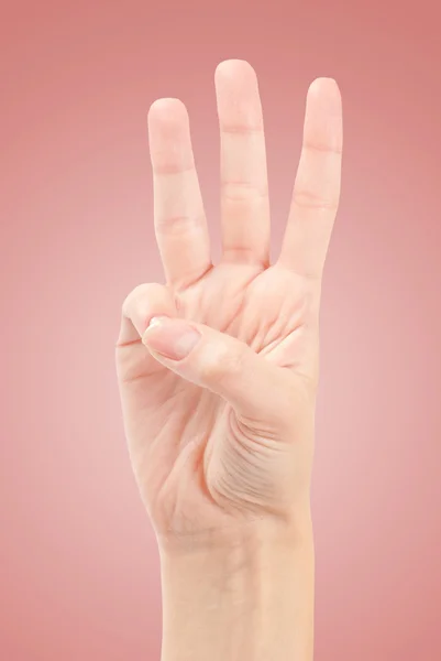 Las manos femeninas contando el número tres — Foto de Stock