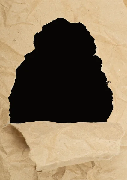 Ripped paper against a black — Stock Photo, Image