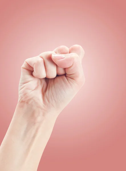 Gebaar van de hand op roze — Stockfoto